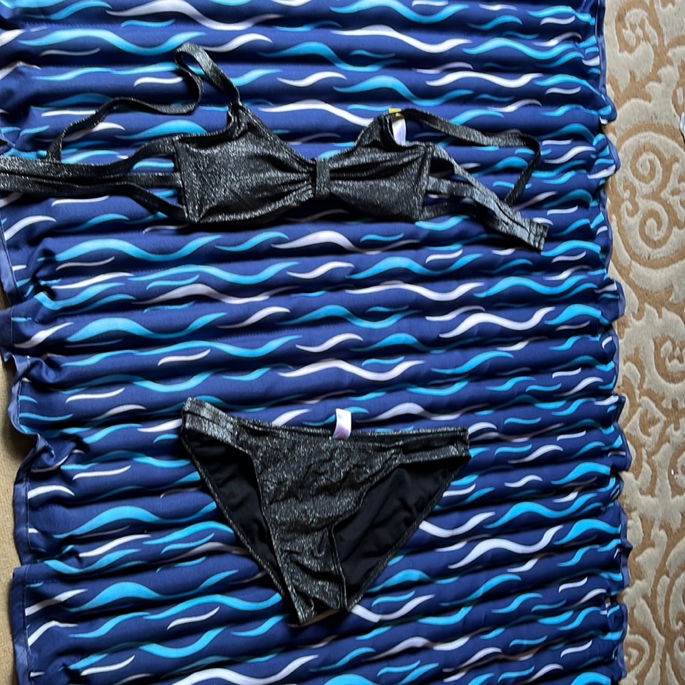 Previously owned, excellent condition black with glitter bikini